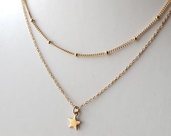 Collier étagé or a chaine double avec pendentif de petite étoile