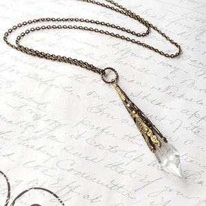 Crystal point filigree pendant antique brass necklace