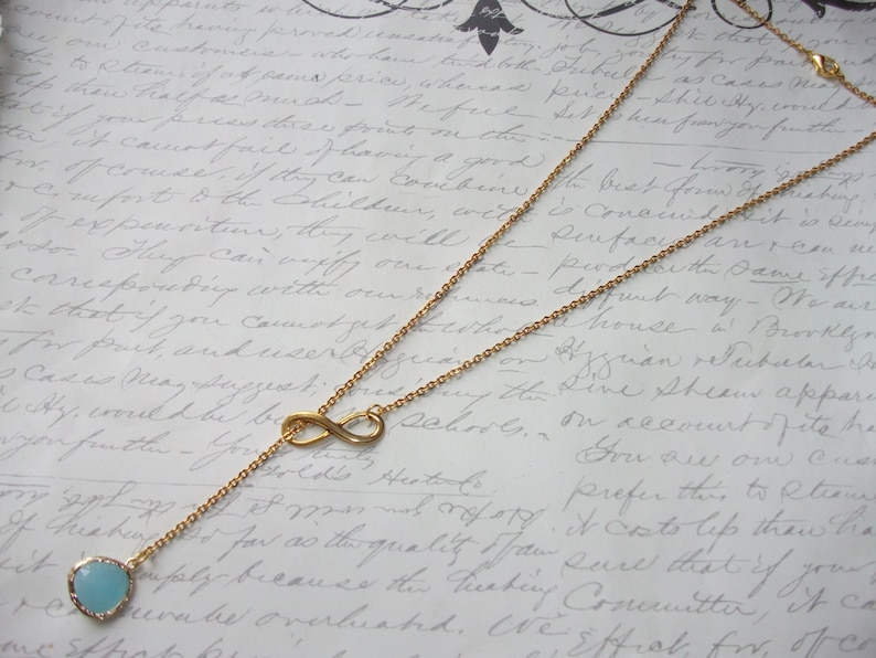Infinity gold lariat necklace with turquoise drop