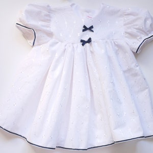 White Embroidered Anglais Baby Dress with Navy Ribbon
