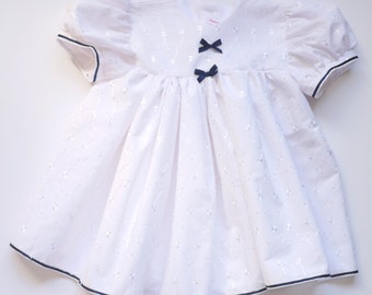 White Embroidered Anglais Baby Dress with Navy Ribbon