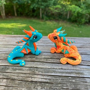 Orange and Teal Dragon Sculptures