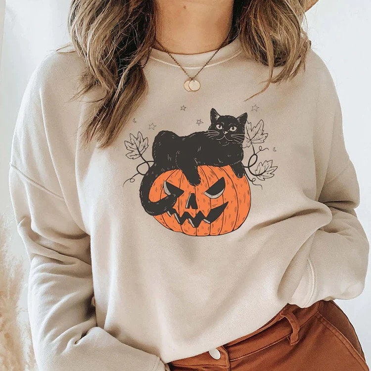 Discover Black Cat on Pumpkin Sweatshirt, Sweater for fall, Black Cat Sweater, Halloween Black Cat Design, Halloween Gifts for Cat Owner, Fall Shirt