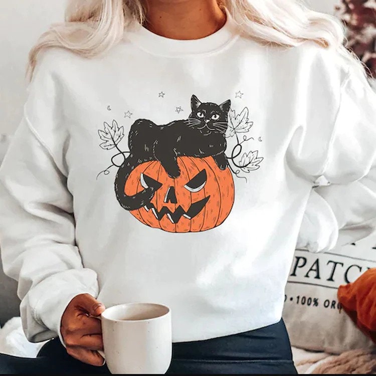 Discover Black Cat on Pumpkin Sweatshirt, Sweater for fall, Black Cat Sweater, Halloween Black Cat Design, Halloween Gifts for Cat Owner, Fall Shirt