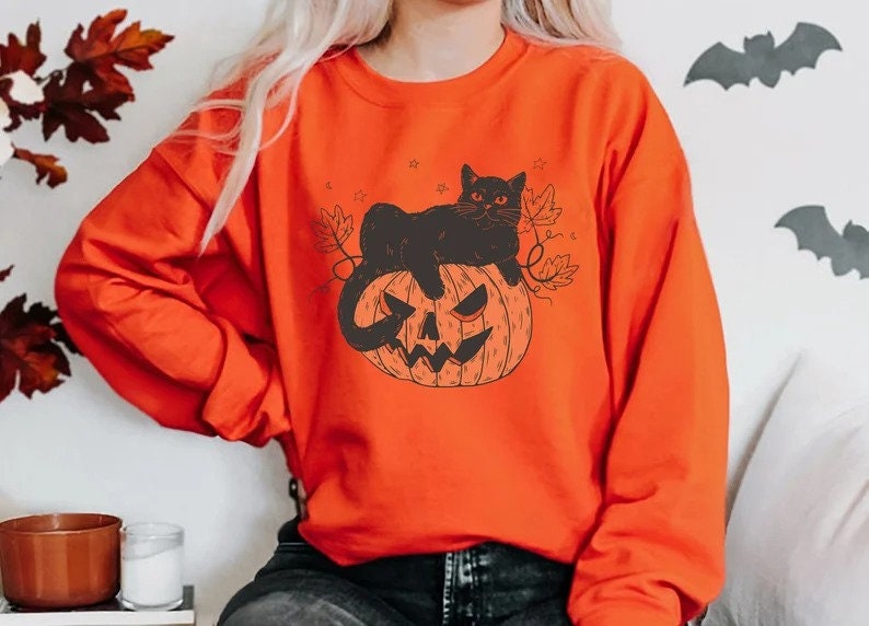 Discover Black Cat on Pumpkin Sweatshirt, Sweater for fall, Black Cat Sweater, Halloween Black Cat Design, Halloween Gifts for Cat Owner, Fall Shirt