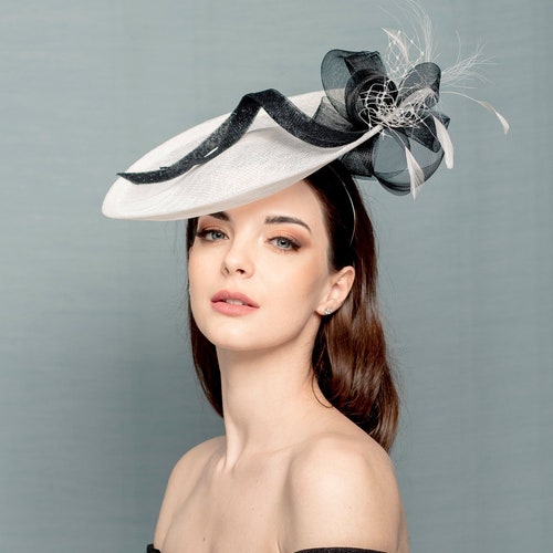 Black Nad White Saucer Hat With Hand 