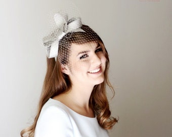 Modern silver fascinator with delicate veiling, silver sinamay bow, silver headpiece, silver head bow, grey russian veiling with silver bow