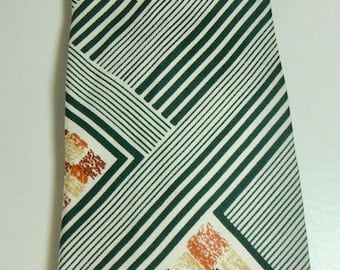 May include: A brown, beige, and green patterned tie with a geometric design.