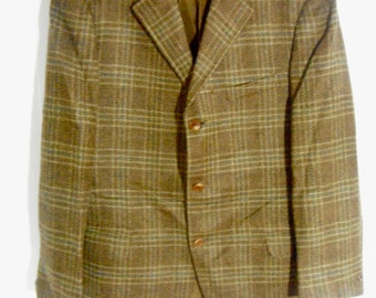 May include: A brown plaid blazer with a button closure. The blazer has a classic style and is made of a soft, comfortable fabric.