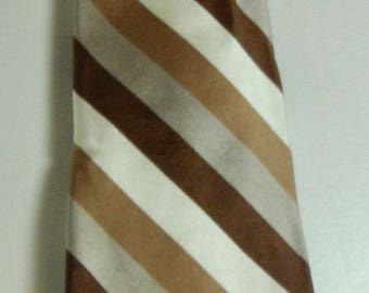 May include: A striped tie with brown, beige, and white stripes. The tie is made of a silky material.