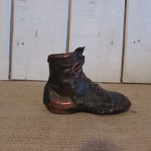 Vintage Bronzed Youth Shoe Bank: Unique Coin Bank Decor