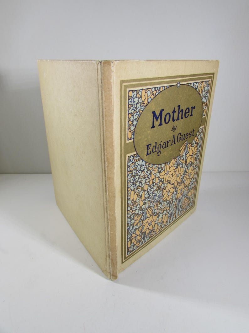 May include: A vintage book titled "Mother" by Edgar A. Guest. The cover features a floral design in shades of blue, yellow, and green.