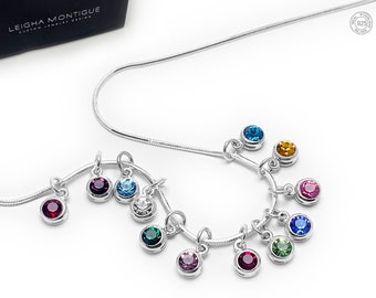 May include: A silver snake chain necklace with 12 birthstone charms, each charm features a different colored crystal. The necklace is displayed on a white background. 12 Birthstones Shown (Jan-Dec) on a Snake Chain. Materials: 925 sterling silver & birthstone crystals.