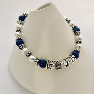 Lapis Lazuli What Would Jesus Do, WWJD, Sterling Silver or Gold, Bali Beads, Sterling Silver, Lapis Beaded Bracelet, W.W.J.D Jewelry, WWJD?, Personal Religious Gifts. Shown with dark blue Lapis Lazuli beads and a lobster claw clasp.