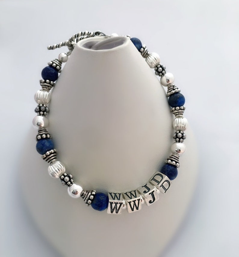 Sterling Silver & Lapis Lazuli What Would Jesus Do, WWJD, Sterling Silver or Gold, Lapis Beaded Bracelet, W.W.J.D Jewelry, WWJD?, Personal Religious Gifts. Shown with dark blue Lapis Lazuli beads and a toggle clasp.