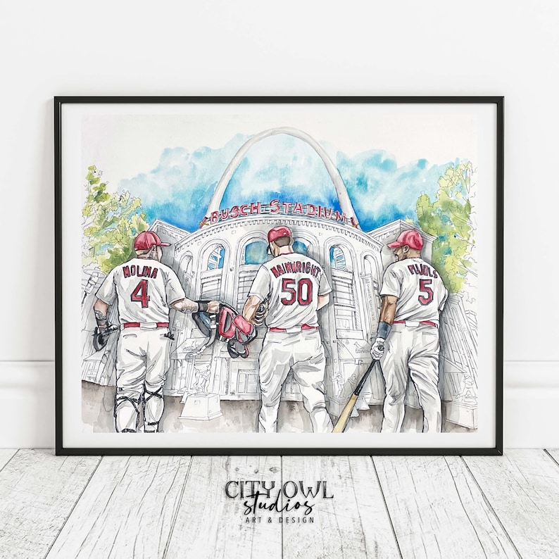 May include: Watercolor painting of three baseball players in red and white uniforms walking away from the camera. The players are wearing numbers 4, 50, and 5. The painting is set against a backdrop of Busch Stadium in St. Louis, Missouri.