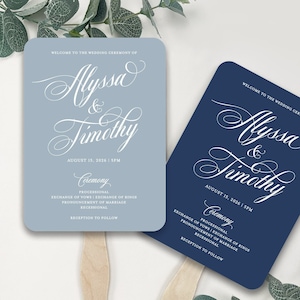 May include: Two wedding fans, one light blue and one navy blue, with wooden handles. Each fan features elegant calligraphy with the names "Alyssa & Timothy" and wedding ceremony details. The fans are a stylish accessory for guests.