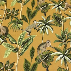 May include: A mustard yellow fabric with a repeating pattern of monkeys, palm trees, and tropical leaves.