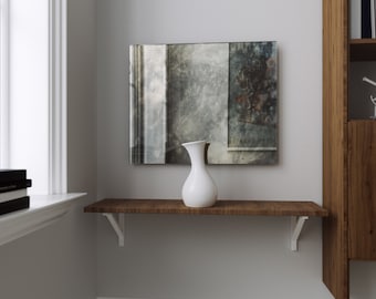 Frameless smoked antique mirror. Antiqued grey glass mirror with cloudy, smokey feel. Vintage-inspired antique wall mirror.