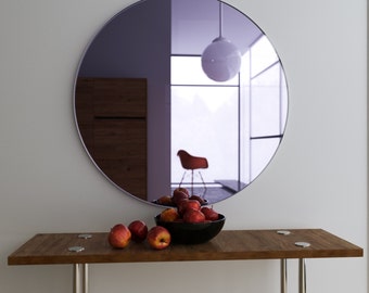 Light purple wall mirror. Large hanging Art Deco mirror with handmade lavender glass and round, chic shape.