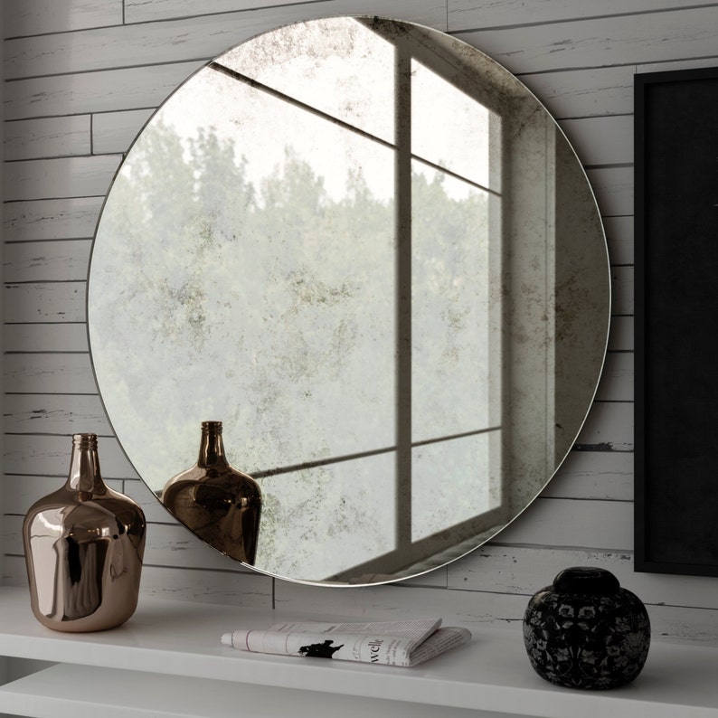 Antiqued modern mirror. Round, MidCentury inspired frameless hanging mirror. Touch of antique mirror. image 1