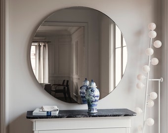 Round Art Deco style mirror. Symmetrical, 1920s and 1930s inspired round mirror with all hanging hardware included.