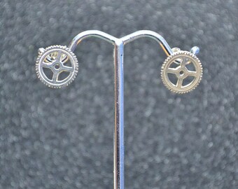 Cast Small Open Gear Stud Earrings - Silver tiny saw toothed gears with holes and sterling posts; non-plated, no nickel and hypoallergenic.