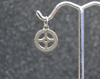 Cast Small Open Gear Pendant Or Charm - Silver tiny saw toothed gear with hole and jump ring bail; non-plated, no nickel and hypoallergenic.