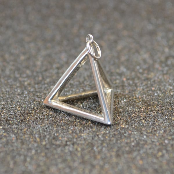 Cast Tetrahedron Pyramid Pendant Or Charm (d4)- Silver, 3D, geometric, triangular wire outlines, non-plated, nickel free and hypoallergenic.