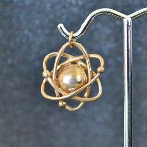 Hollow Cast Dimensional Atom Pendant -  Bronze stylized subatomic structure models, non-plated, nickel free and hypoallergenic.