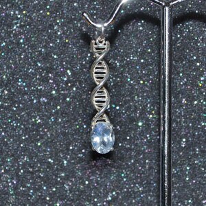 Double Helix DNA Pendant or Charm with Rainbow Moonstone. Sterling silver, 8 x 6 mm faceted gem, non plated, no nickel and hypoallergenic.