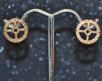 Cast Small Open Gear Stud Earrings - Bronze tiny saw toothed gears with holes and gold fill posts; non-plated, no nickel and hypoallergenic.