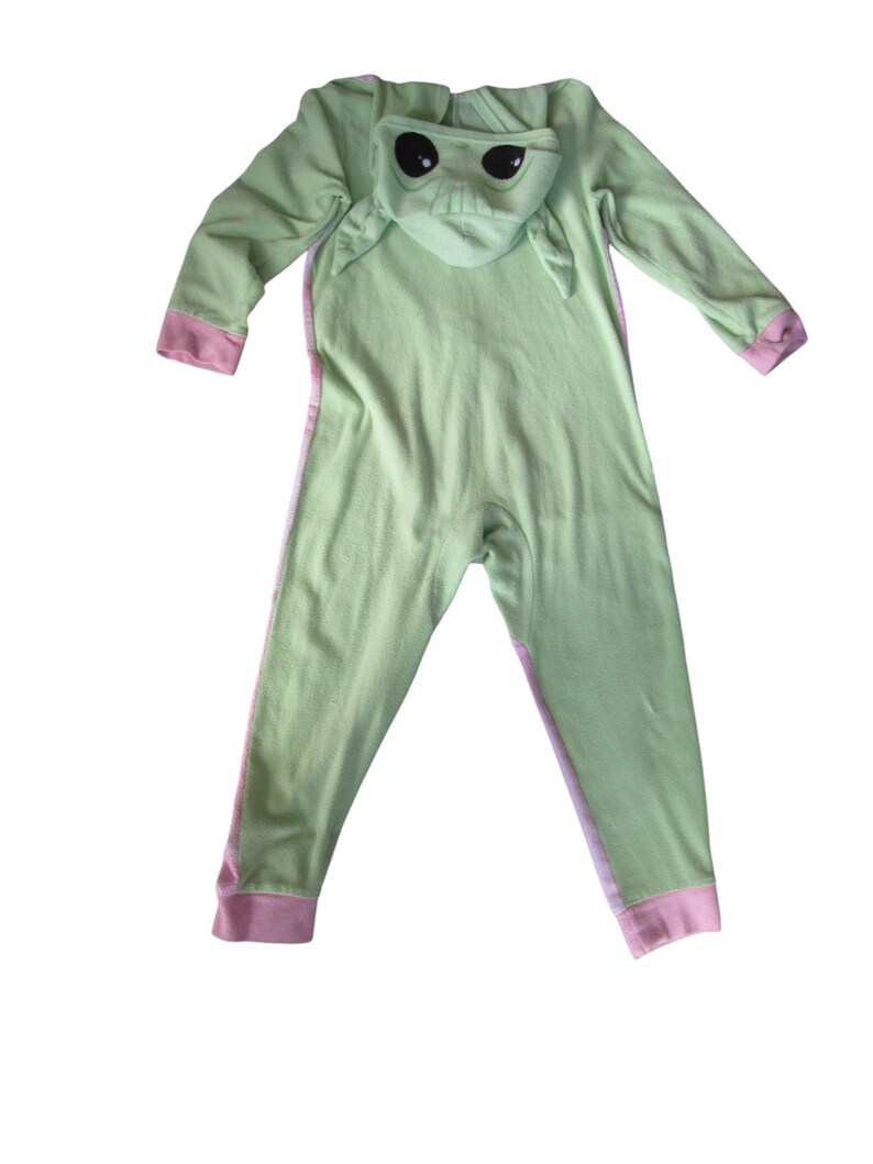 May include: Green and pink hooded onesie with a character from the Star Wars franchise, The Mandalorian, on the hood.
