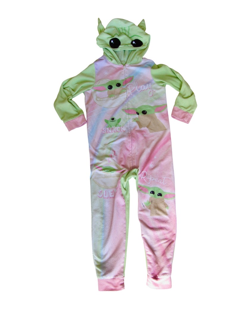 May include: Green and pink hooded onesie with a character from the Star Wars franchise. The onesie has the words "Play", "Snack", "Sleep", and "Repeat" printed on it.