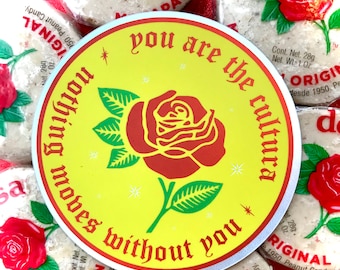 May include: A yellow and white round sticker with a red rose and the text "you are the cultura nothing moves without you".
