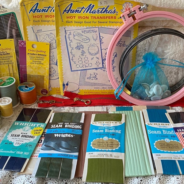 Vintage sewing notions lot, vintage seam binding, thread, buttons, embroidery hoops, needles, zippers and iron transfers- 60 piece lot