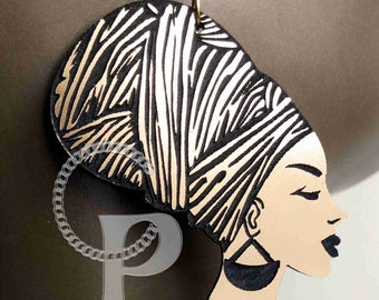 African earrings woman head wrap silhouette metallic look gold and black