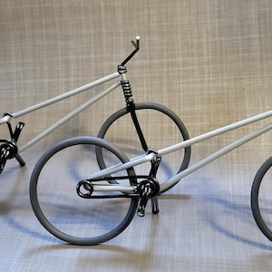 Miniature trial bike in aluminum wire. Trial bike in aluminum wire