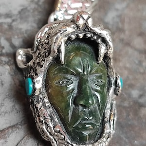 jaguar warrior in silver and jade.
