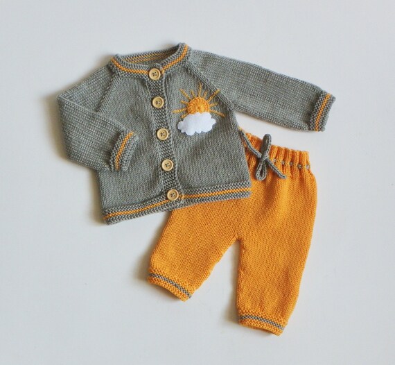 yellow knitted baby outfit