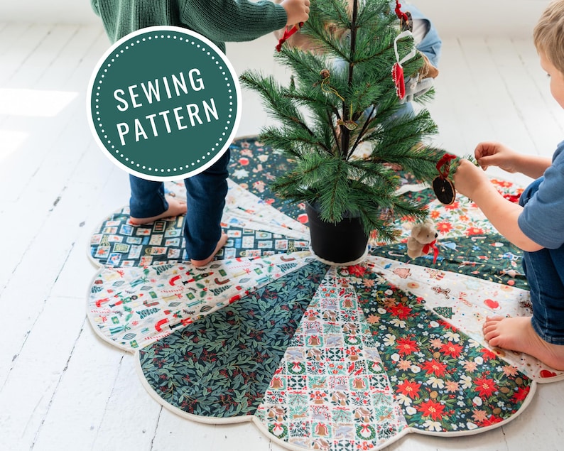 May include: A circular fabric Christmas tree skirt featuring a patchwork design of various holiday-themed patterns including poinsettias, holly, and festive icons. The skirt has a scalloped edge and a green circular label reading SEWING PATTERN.