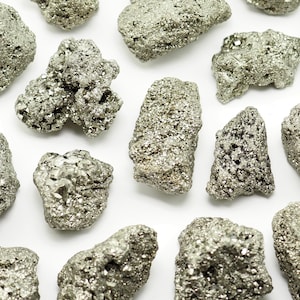 May include: A set of three ceramic nesting bowls in shades of blue, green, and white. The bowls feature a speckled glaze and a simple, modern design. The largest bowl measures approximately 6 inches in diameter.