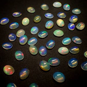 ONE Opal cabocohon from Ethiopia fire flash oval polished stone loose natural birthstone image 3
