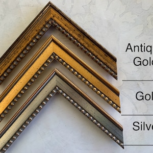 May include: Three picture frames in different finishes: antique gold, gold, and silver. Each frame has a beaded edge.