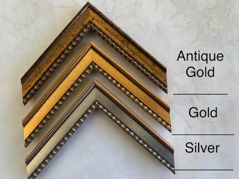 May include: Three picture frames in different finishes: antique gold, gold, and silver. Each frame has a beaded edge.
