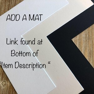 May include: An angled view of three mat boards in white, cream, and black. Text on the white mat reads "ADD A MAT" and "Link found at Bottom of 'Item Description'". The mats are arranged on a wood-grain surface.