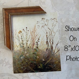May include: A framed painting of a field of wildflowers in shades of brown, green, and white. The painting is shown in an 8x10 inch frame.