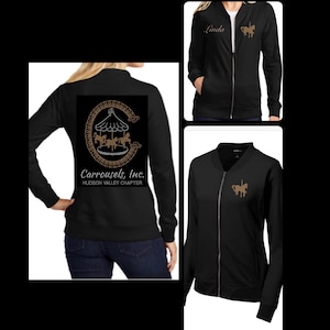 May include: Black zip-up jacket with a gold embroidered carousel horse on the left chest. The back of the jacket has a gold embroidered carousel with the text "Carrousels, Inc. Hudson Valley Chapter".
