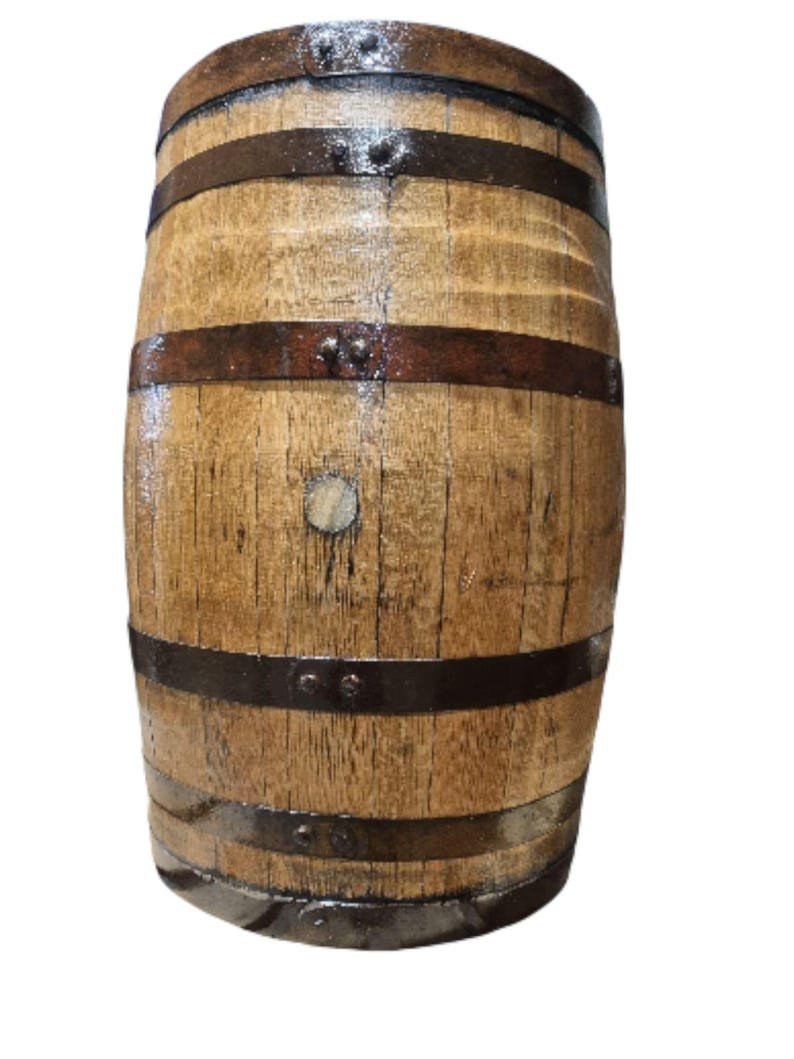 May include: A wooden barrel with dark metal bands. The barrel has a light brown color with visible wood grain and is held together by several dark metal bands. The barrel is likely used for storage or decoration.
