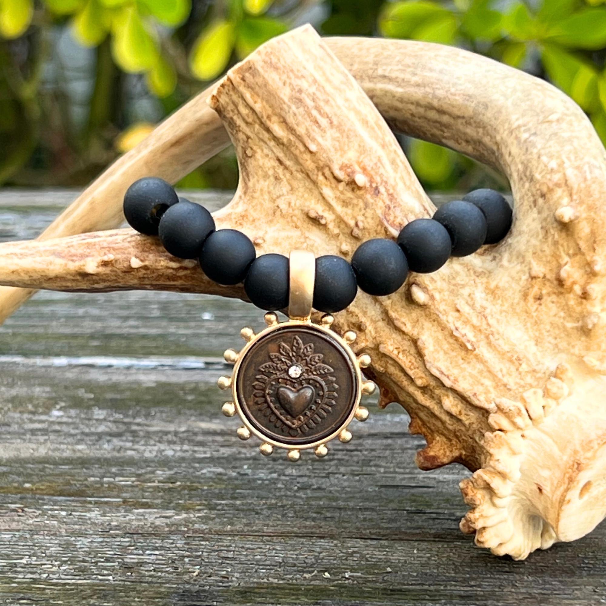 Rustic Brown Milagro Sacred Heart Pendant on Matte Black Glass Beaded Bracelet